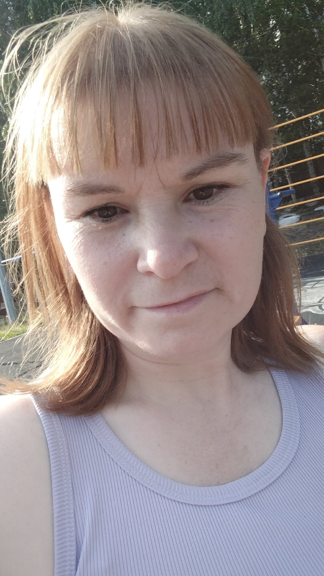 Sunny day out with flowers, a parking lot, and a plush bunny