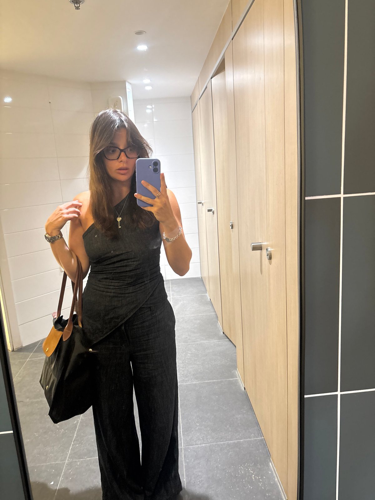 Woman Takes Mirror Selfie in Tel Aviv Public Facility