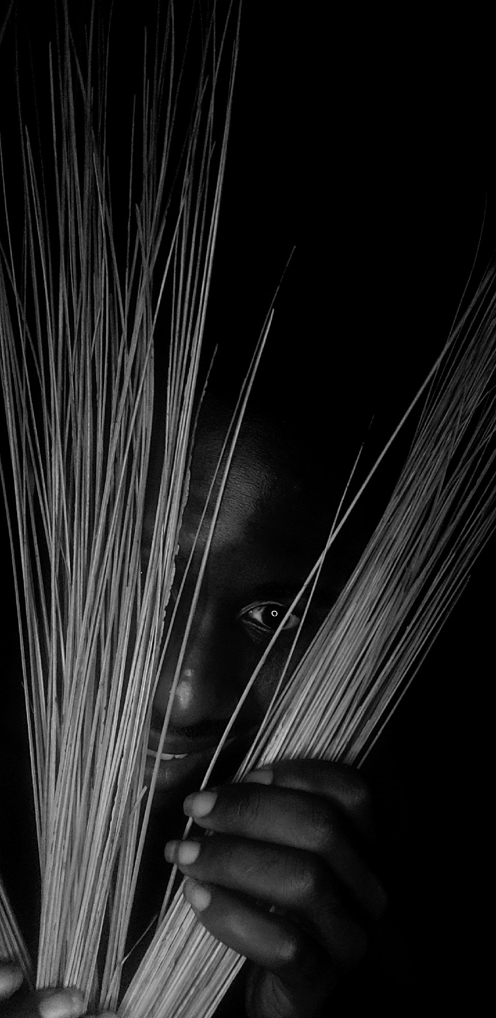 Person photographed with straw, matchbox in Narayi, Nigeria