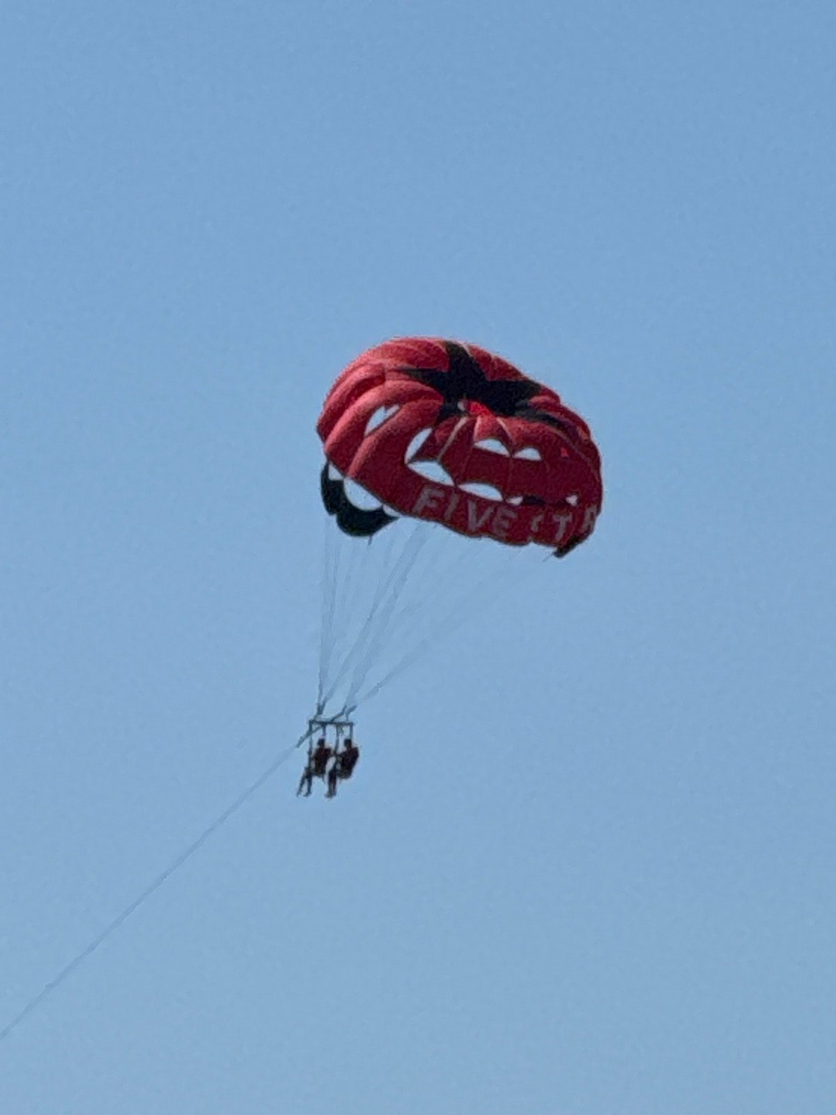 Tandem parasail ride over Aguadulce on a clear summer morning