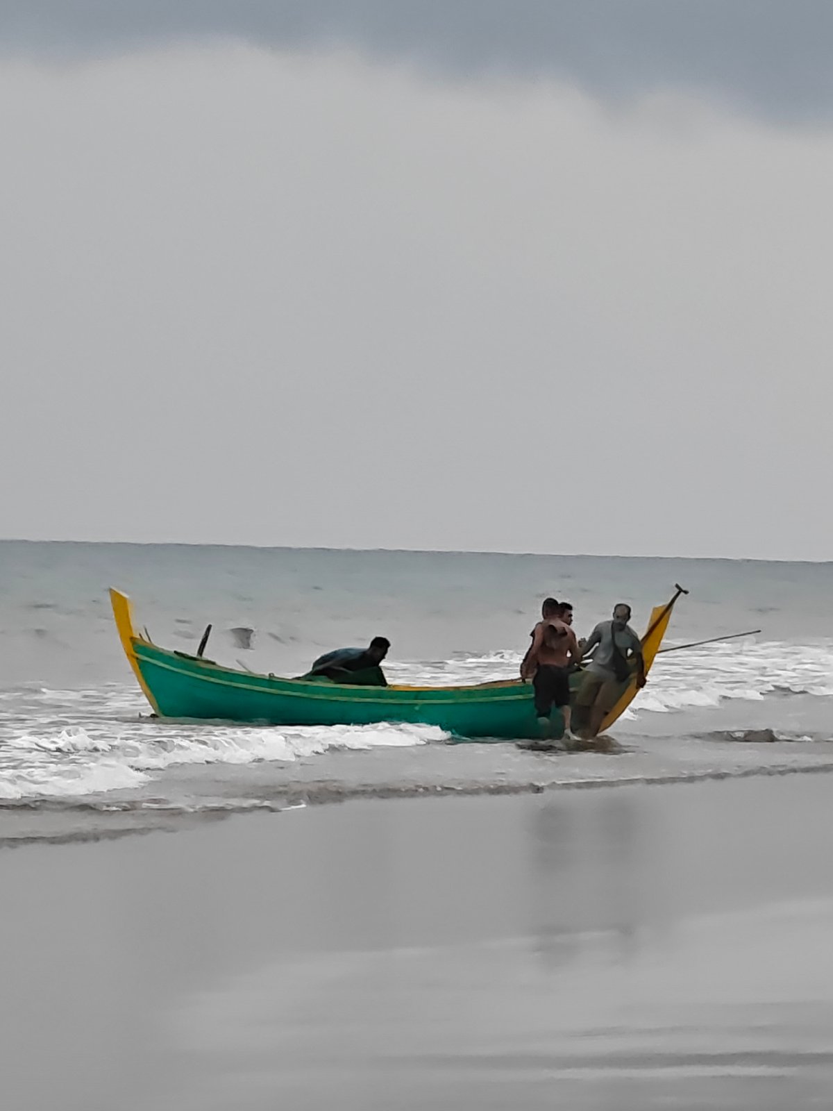 Fresh catch lands on a Curehtunong beach at dawn