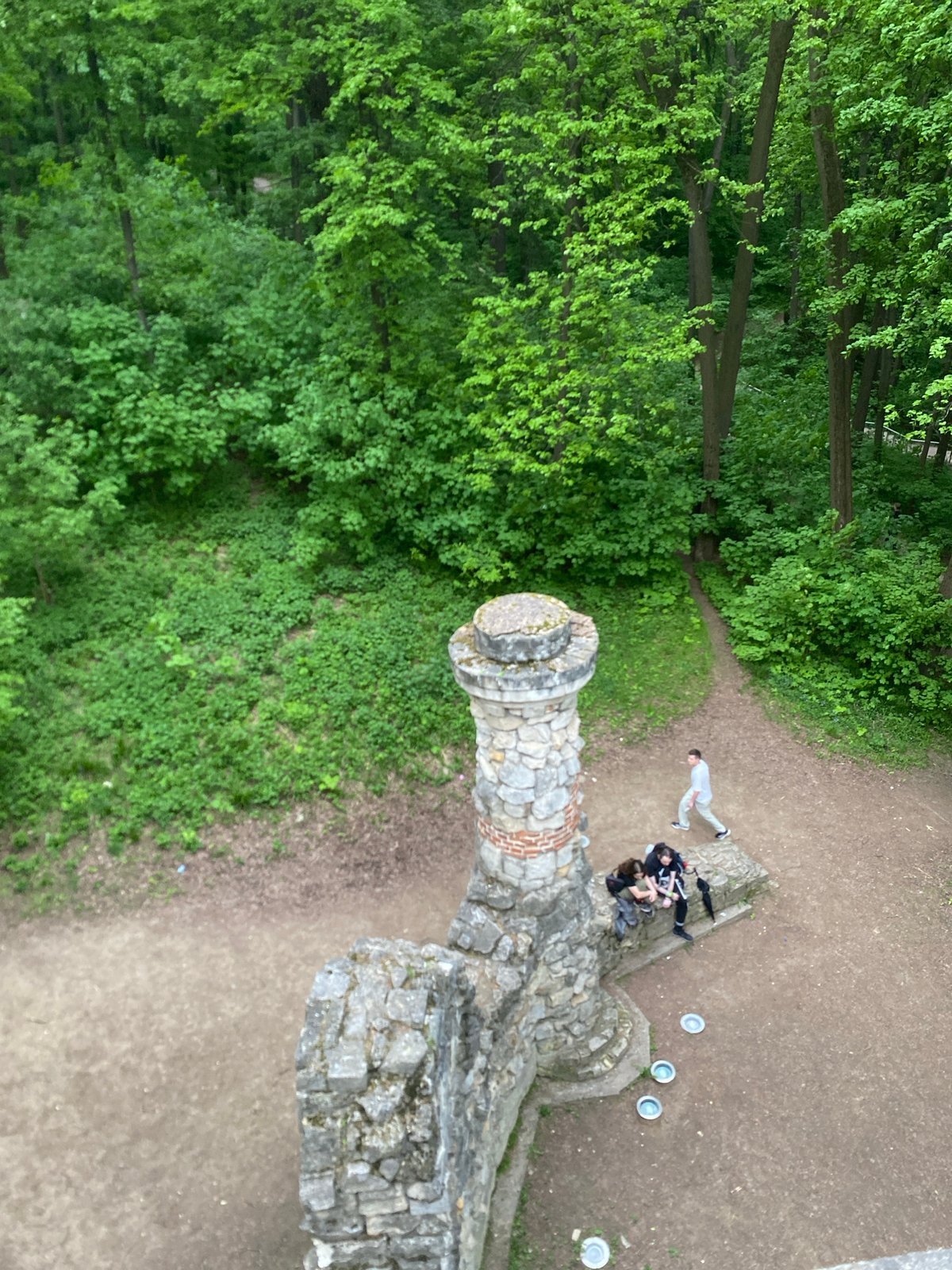 Afternoon visitors explore Moscow's Tsaritsyno Park, swans, castle ruins