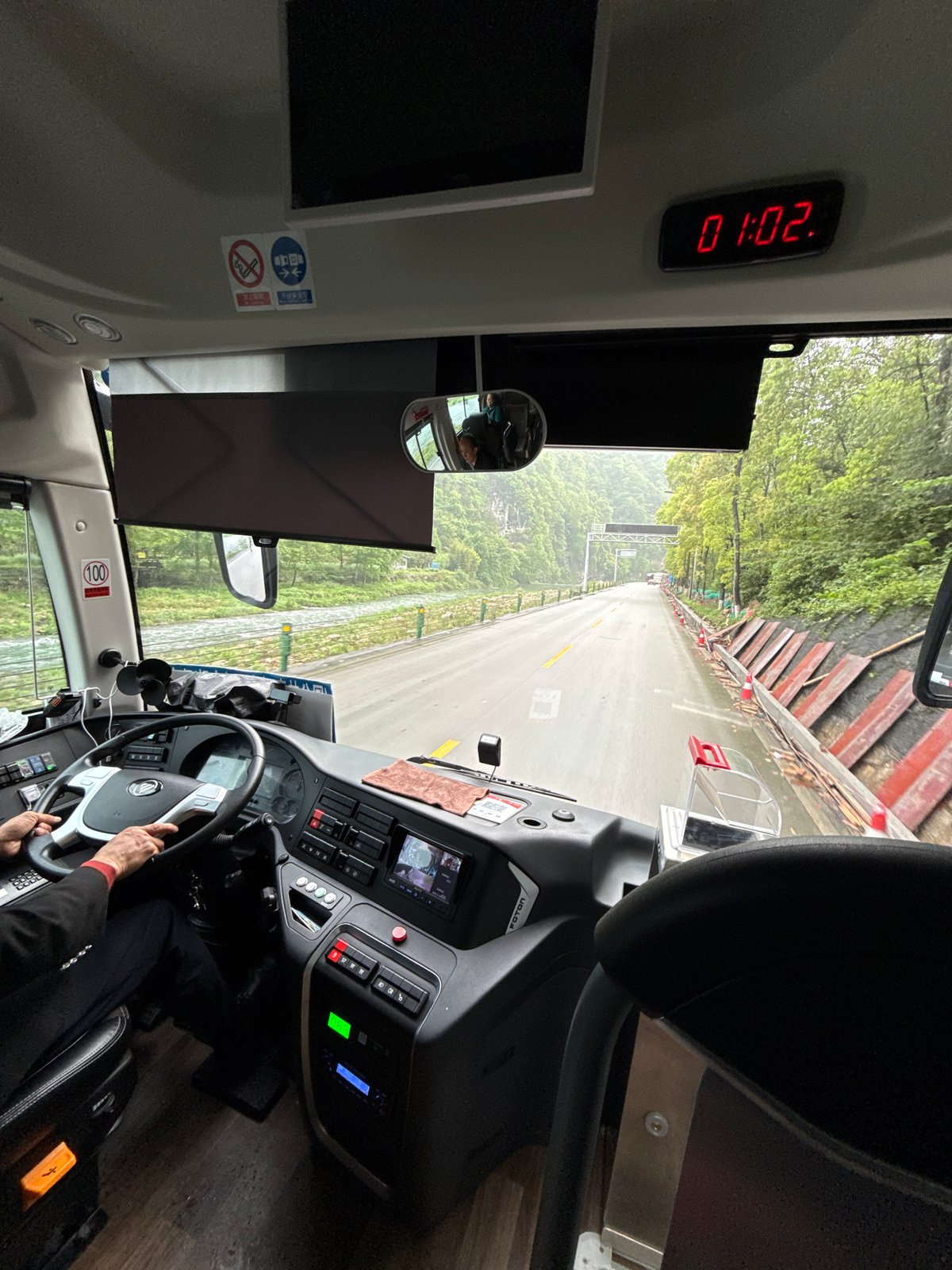 Late night bus travels through green Wulingyuan landscape