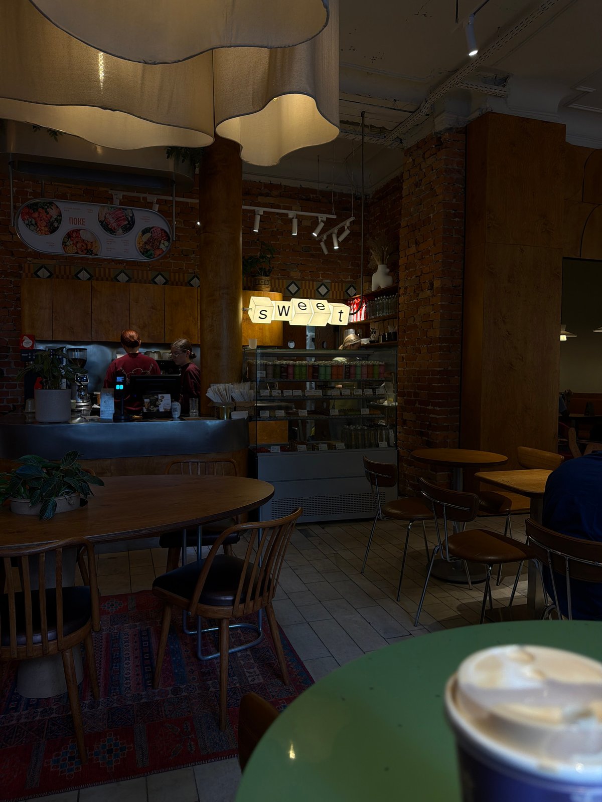 Reading 'Fear... But Act!' at a Voronezh café