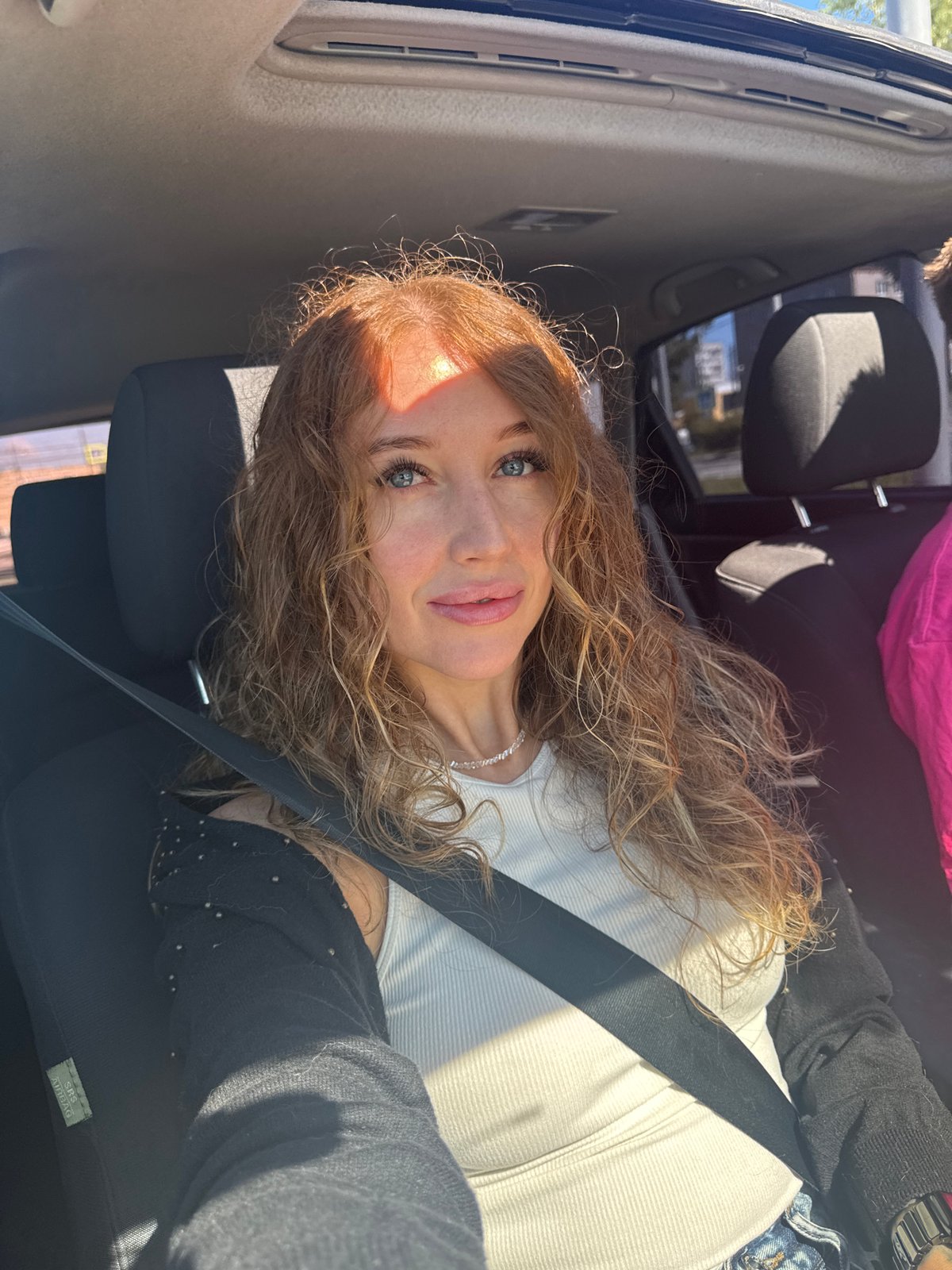 Woman photographs daisies, beetles during early morning car trip