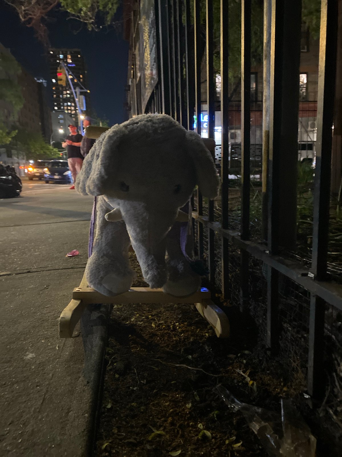 Rocking horse spotted on NYC sidewalk at night
