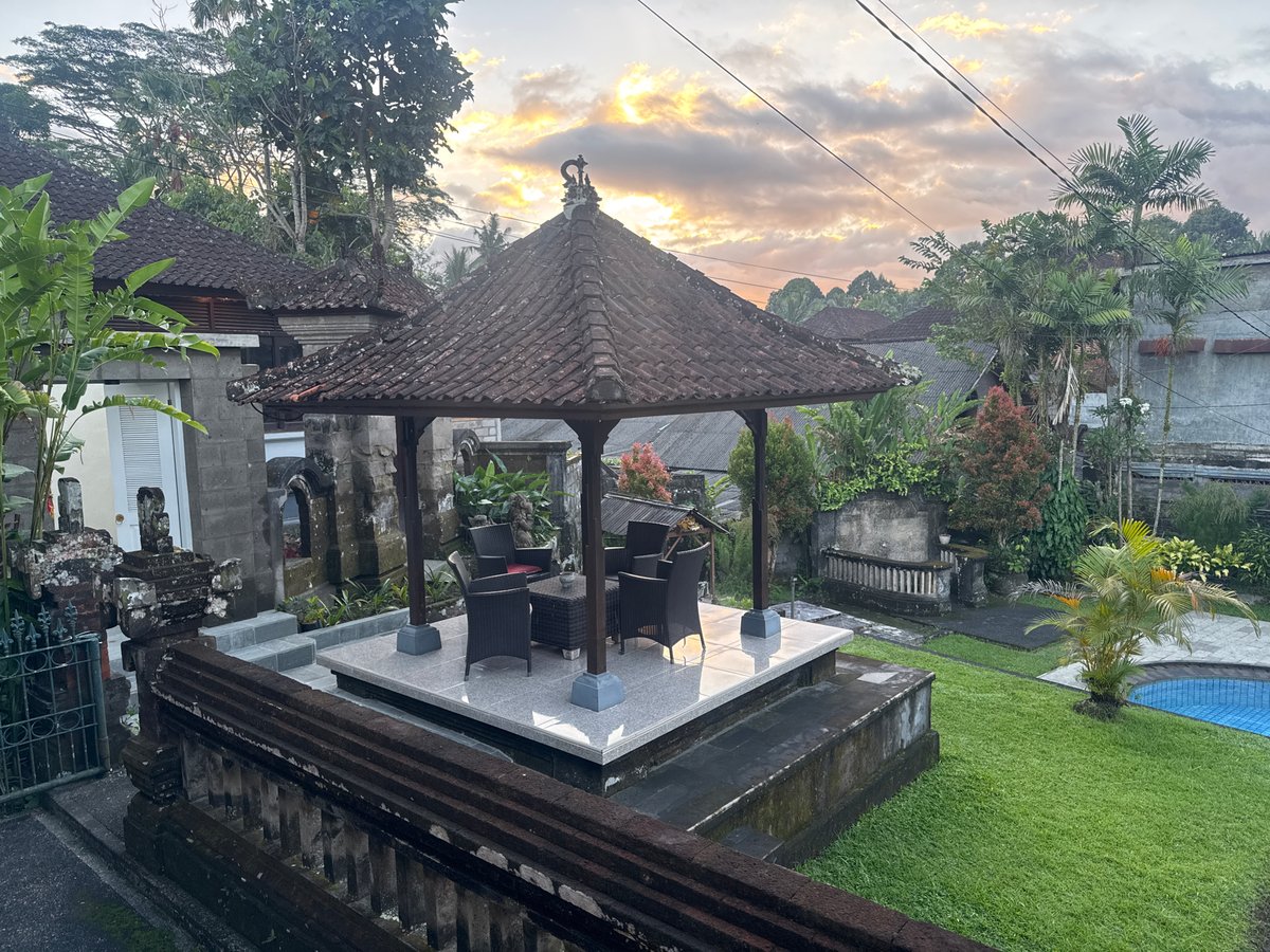 Traditional Balinese residence observed at dusk in Ubud District