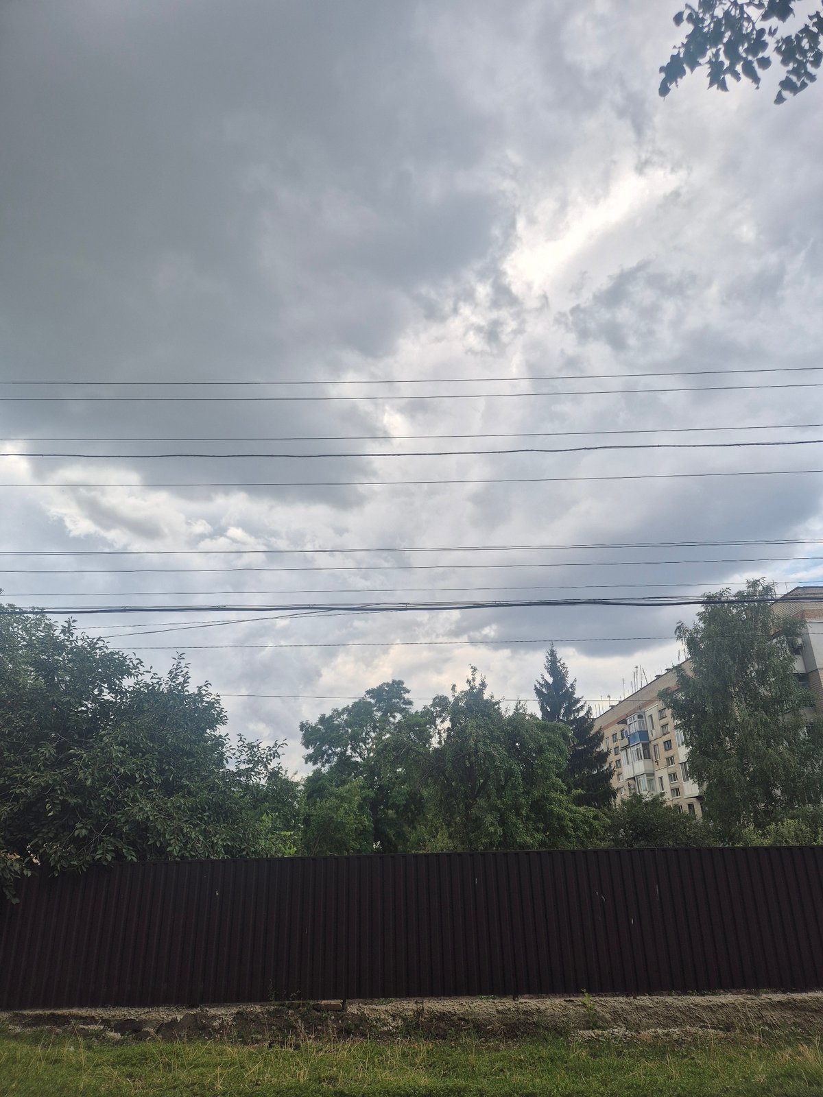 Quiet village streets in Sozonivka, Ukraine, alongside war damage