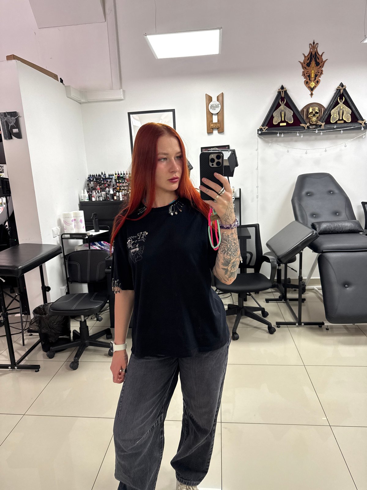 Woman takes selfies in Rostov-on-Don tattoo studio
