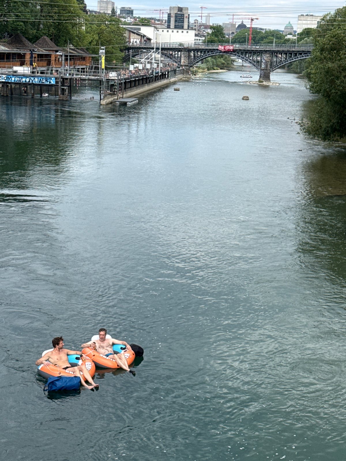 Tubing down the Limmat on a summer afternoon in Zurich