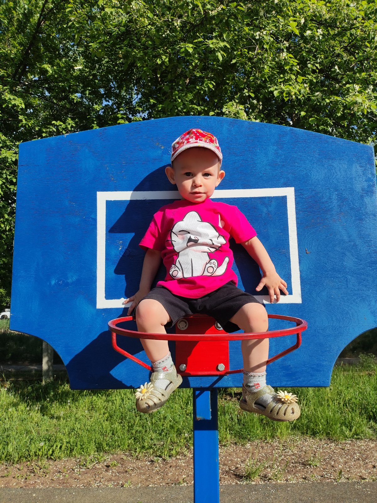 Toddler sits on basketball hoop in Chaikovsky, Russia