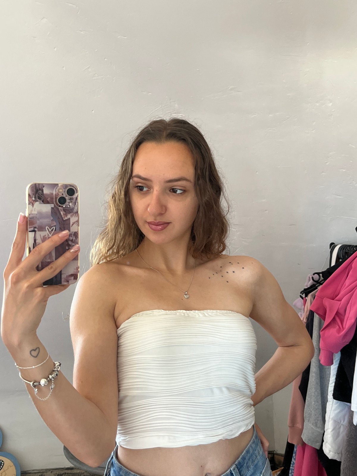 Woman takes multiple selfies indoors in Saarbrücken