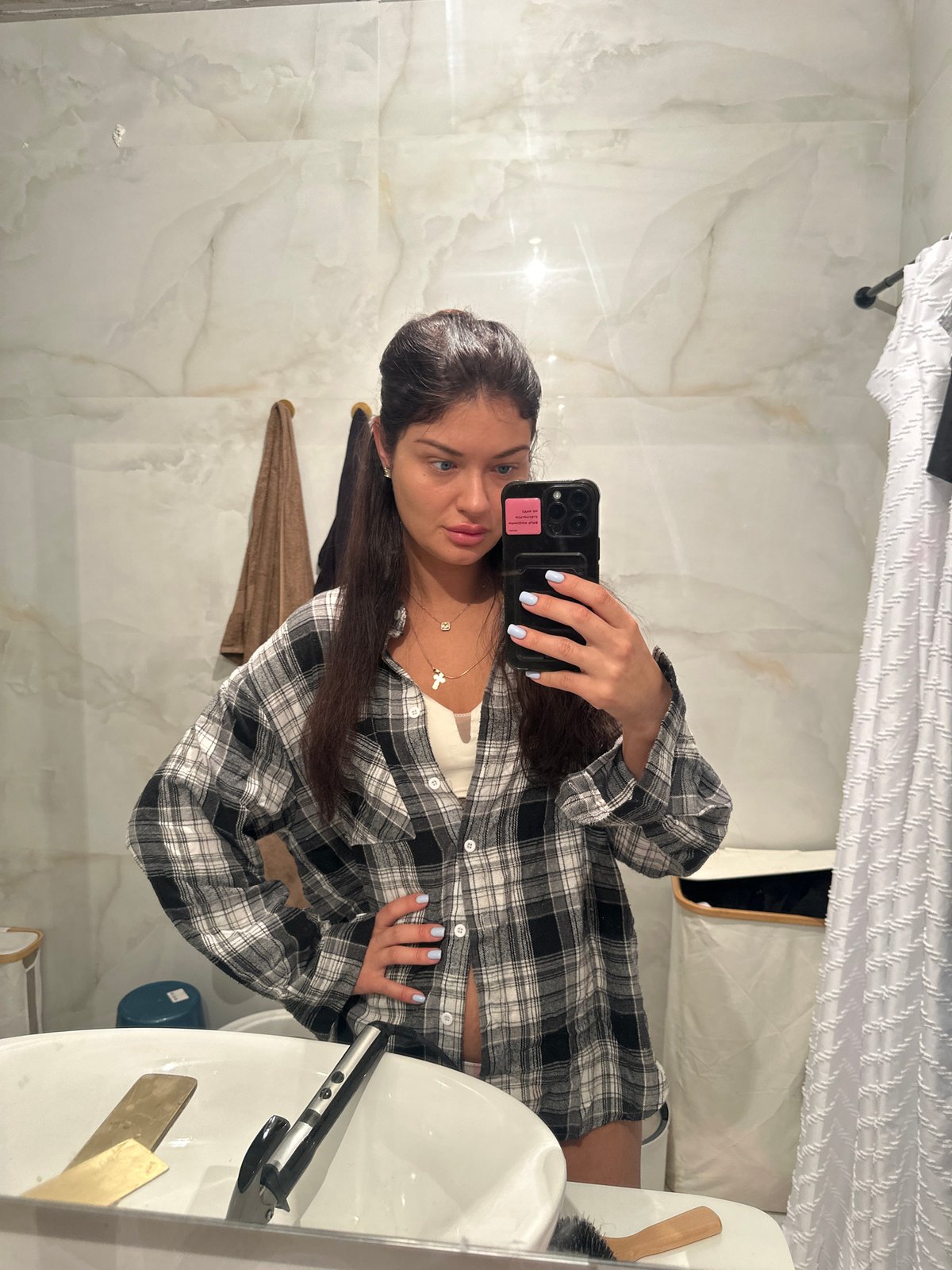 Woman takes bathroom selfie in Khimki, Russia
