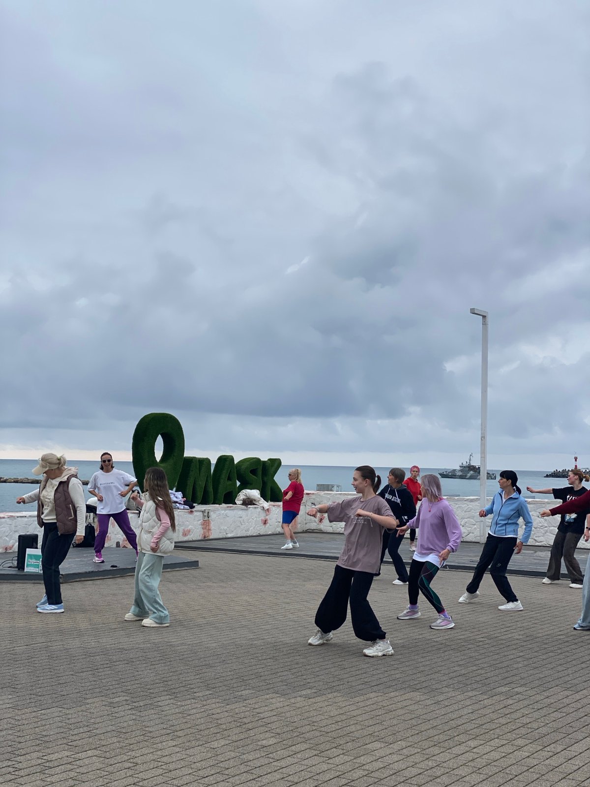 Palm trees and pedestrians observed in Sochi street scenes