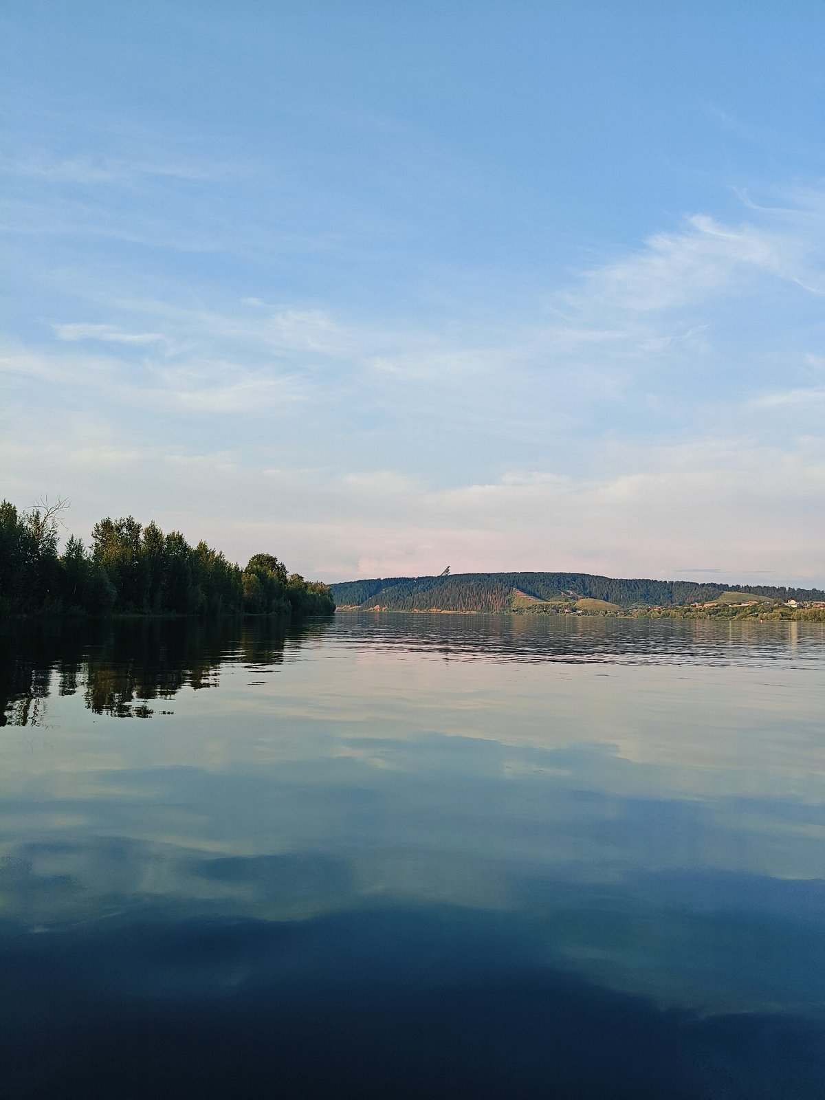 Sunset fishing trip on a calm Russian river