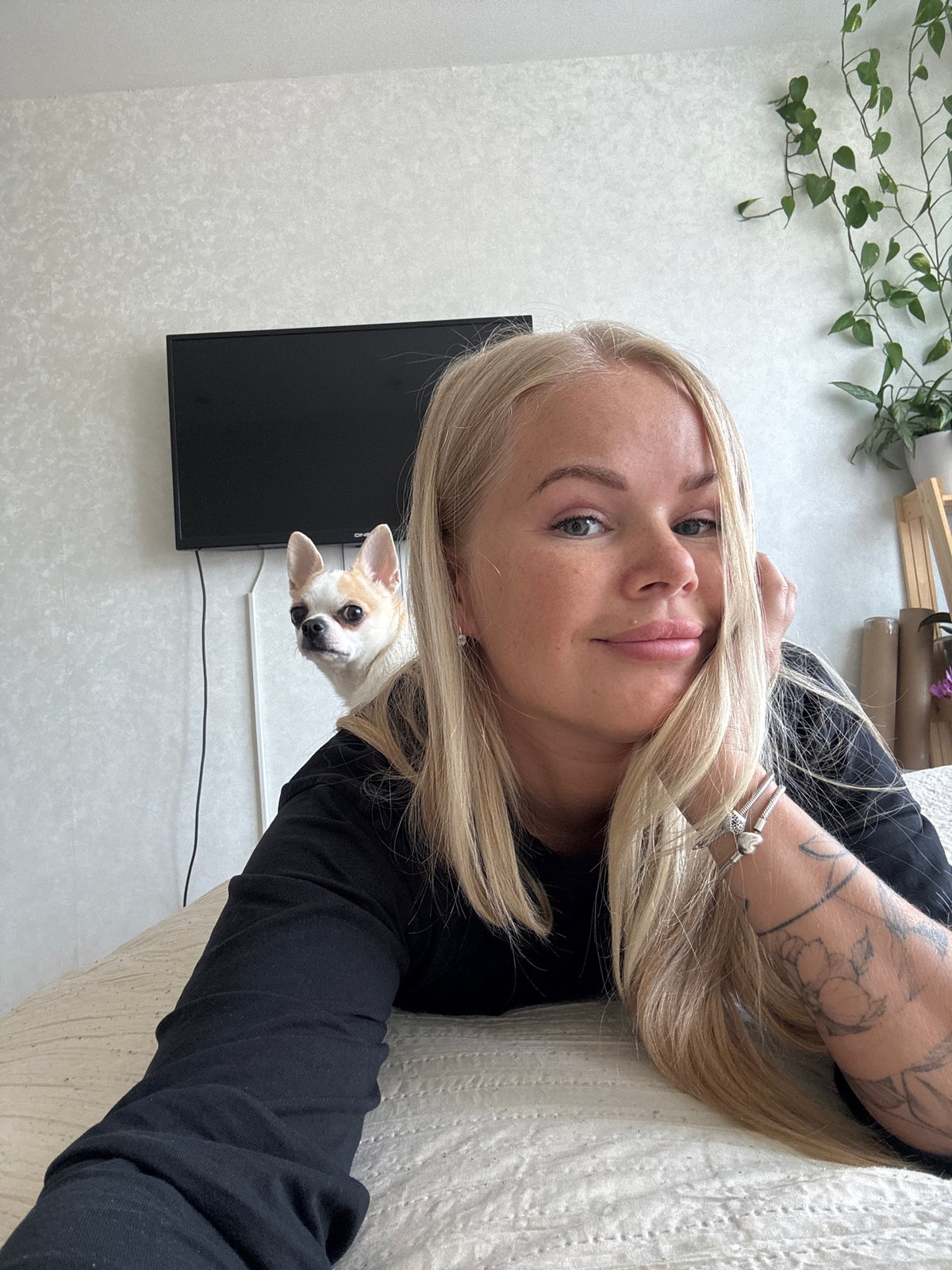 Woman documents morning routine with selfies and pet Chihuahua