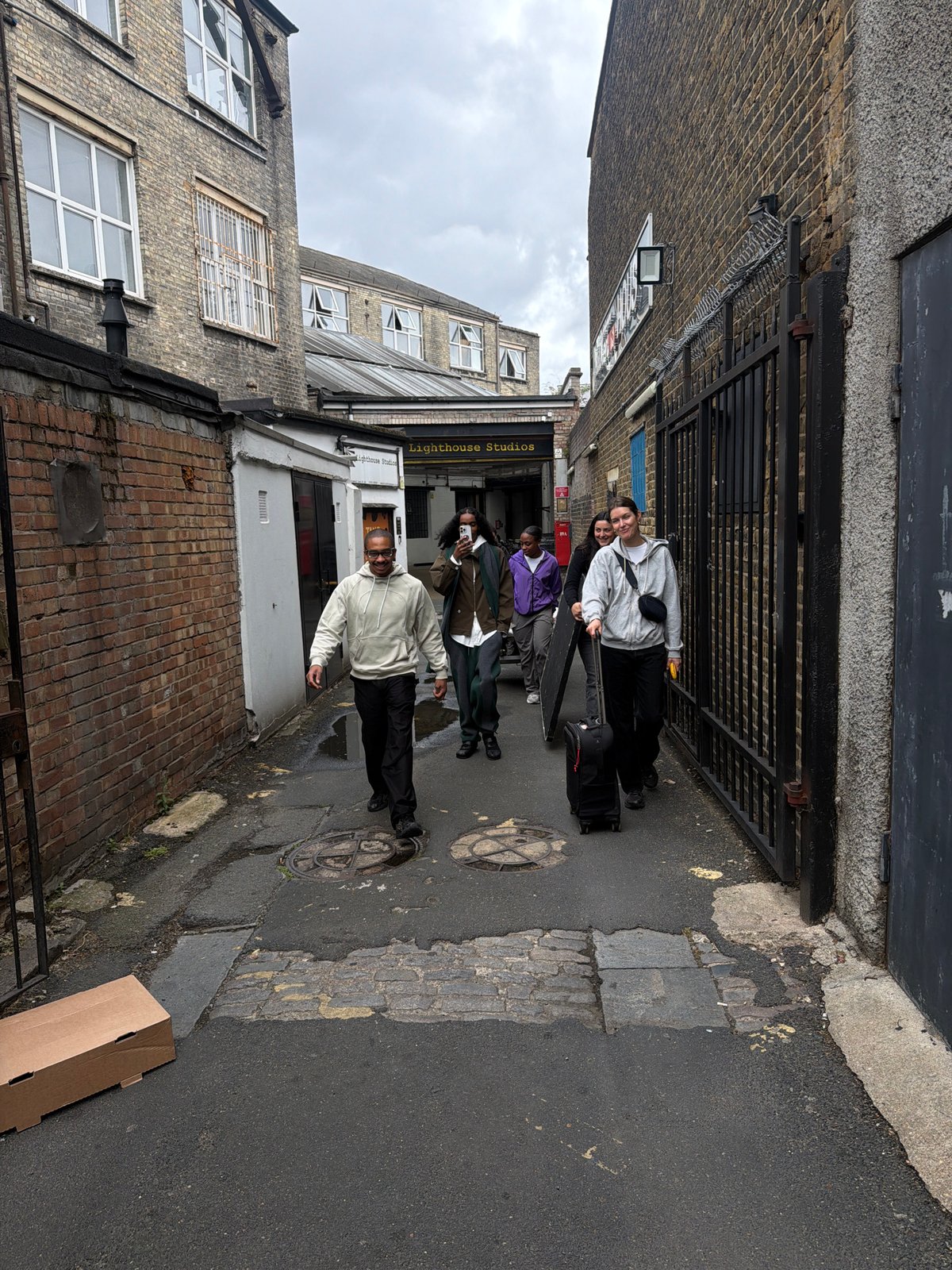 Young adults film photoshoot in Hackney alleyway Wednesday morning