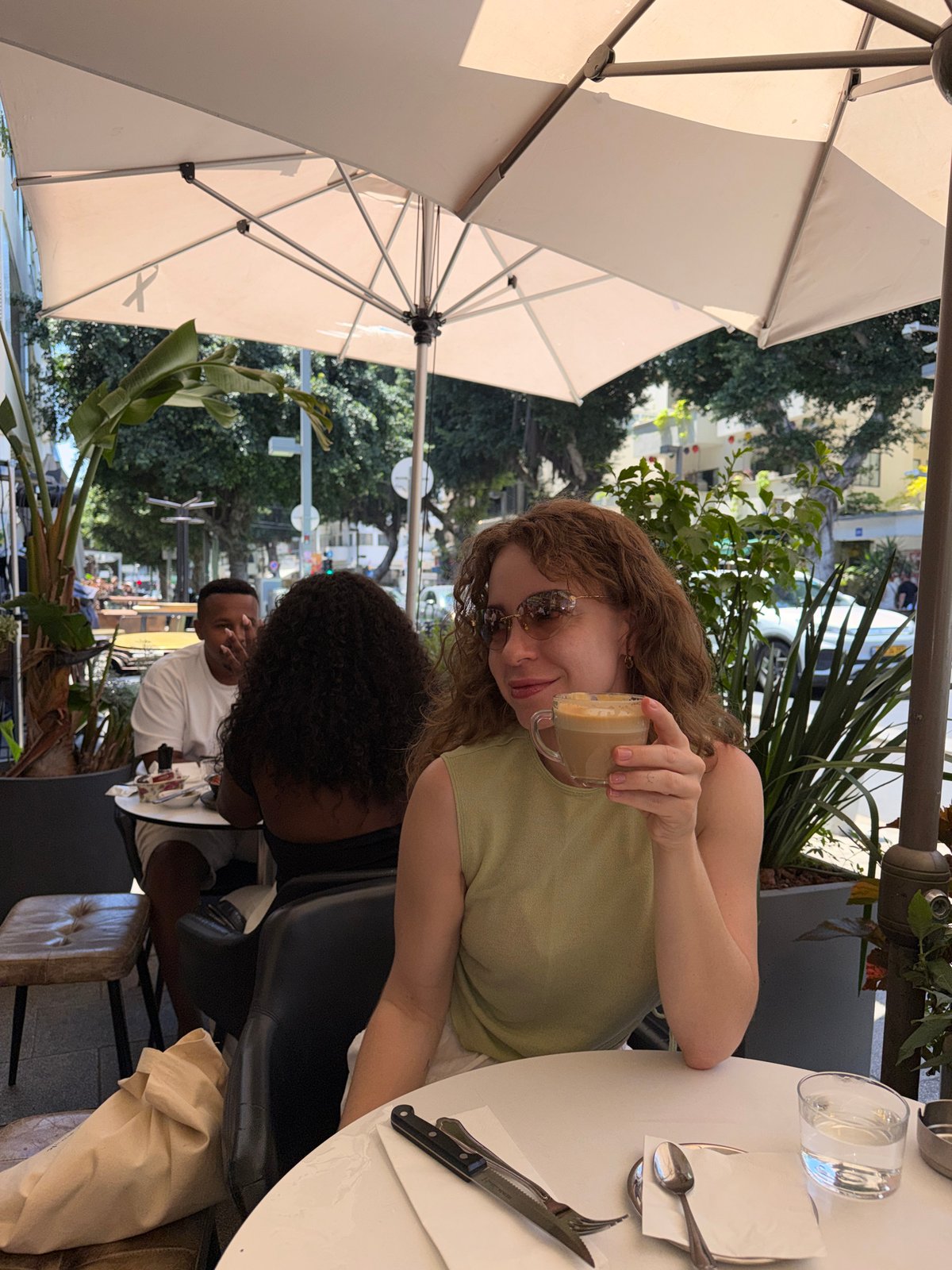 Morning street life documented across Tel Aviv cafés and crosswalks
