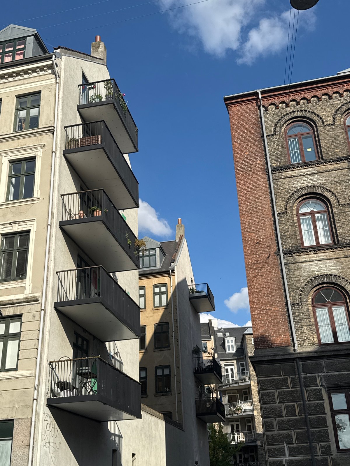 Wine, bikes, and blue buildings on a Copenhagen afternoon