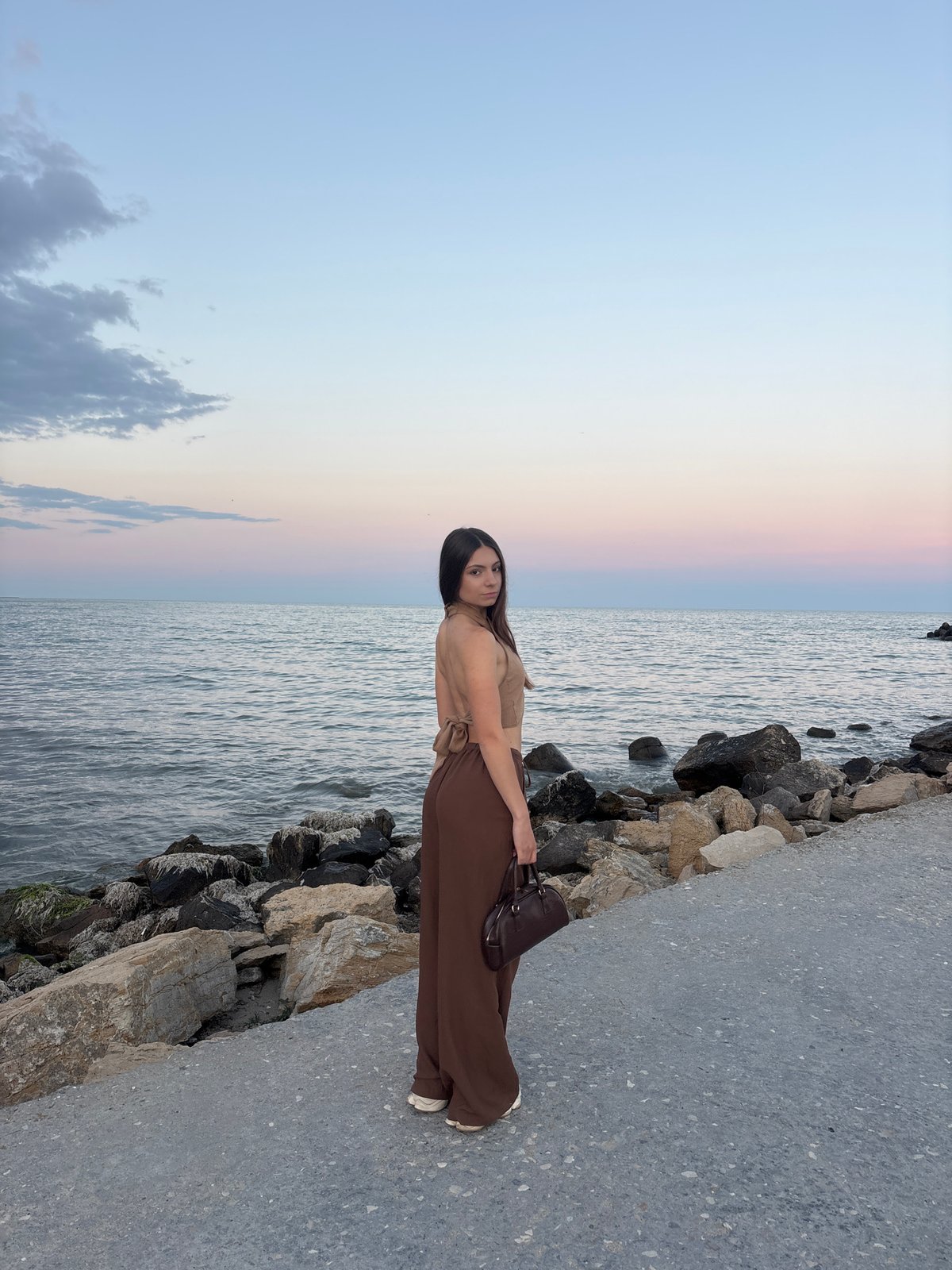 Quiet moment on Varna's rocky shoreline at golden hour