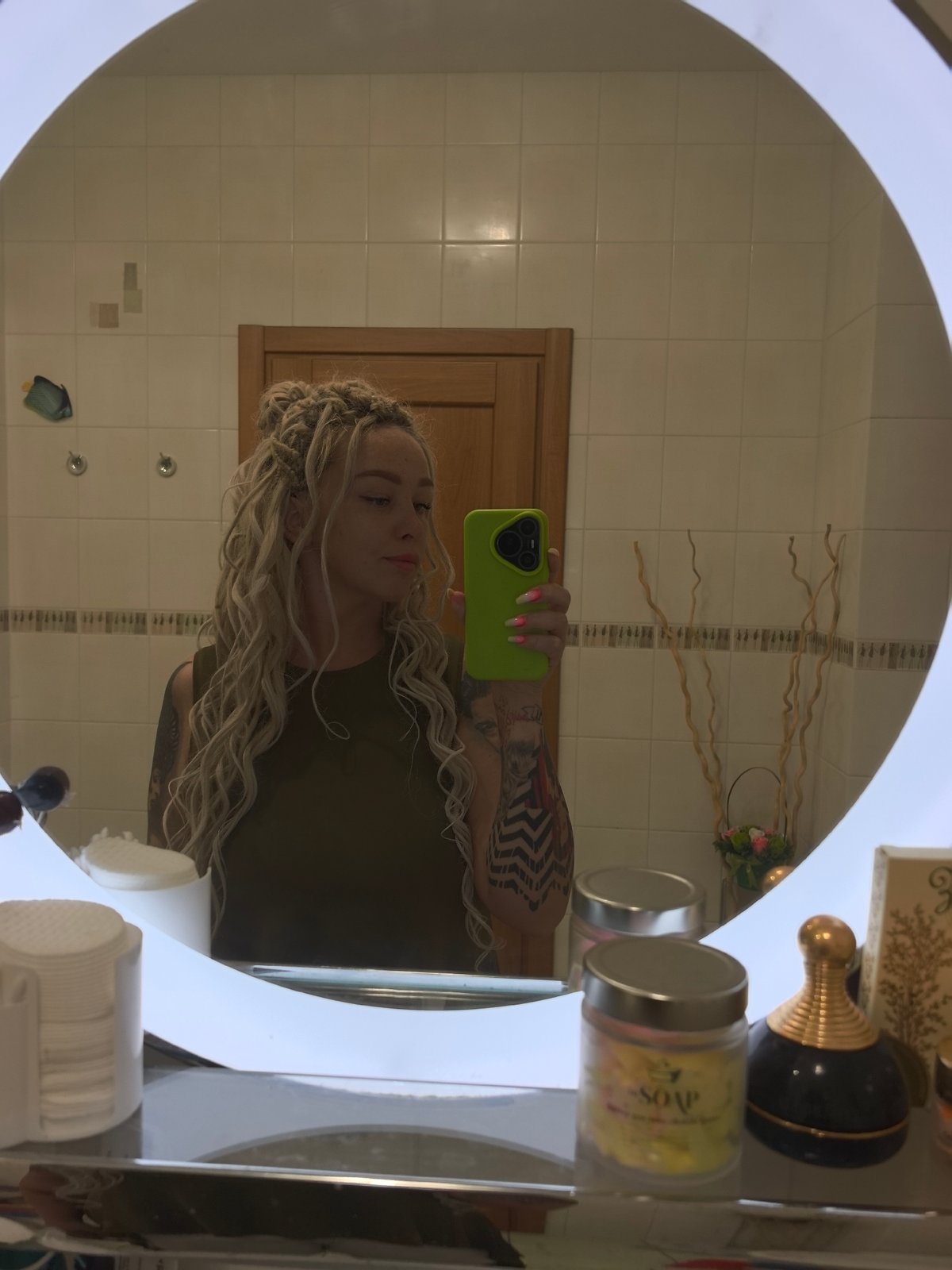 Bathroom mirror selfie with a green phone, Nizhny Novgorod