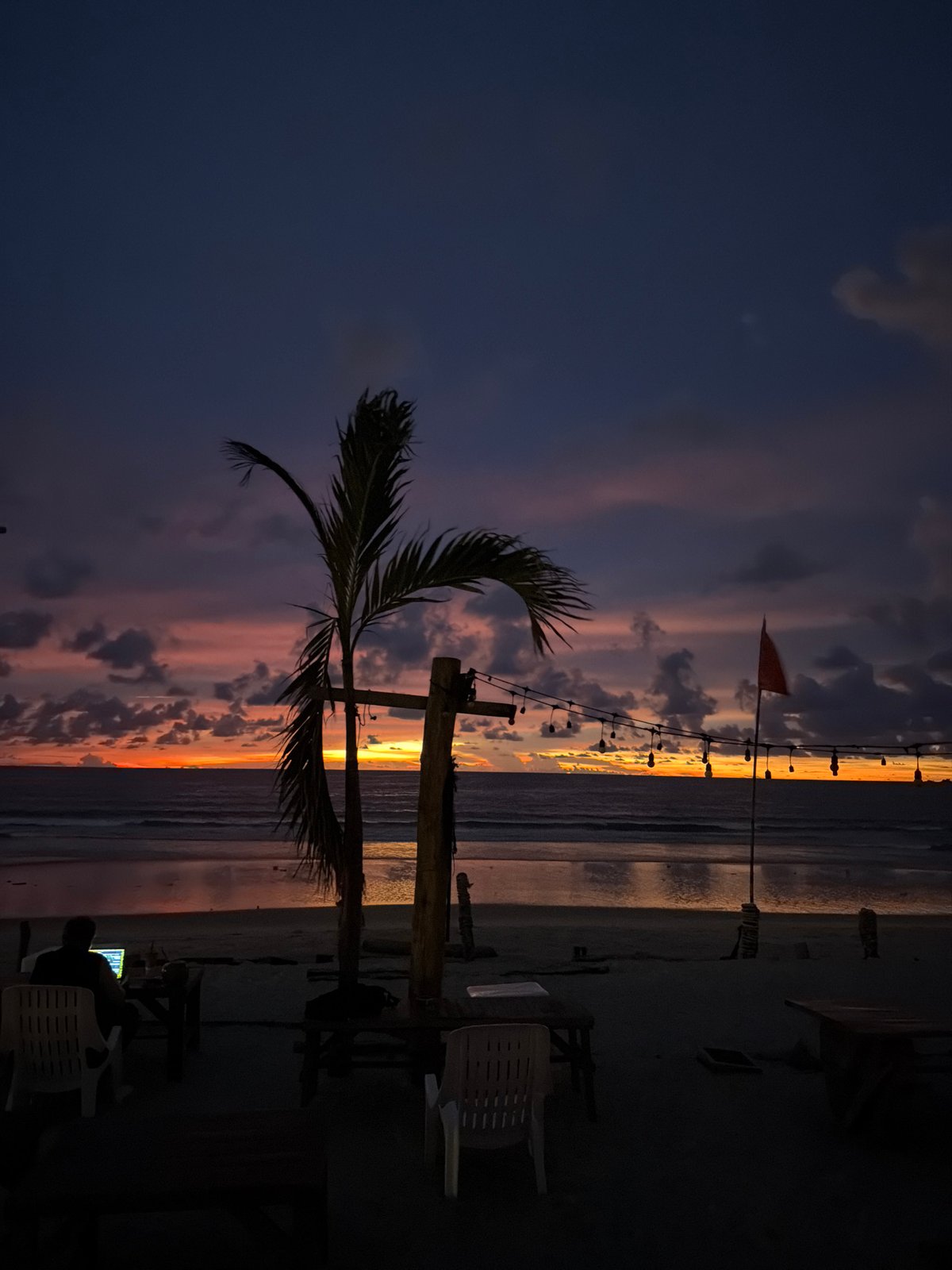 Sunset hour on a Choeng Thale beach, silhouettes and fading light