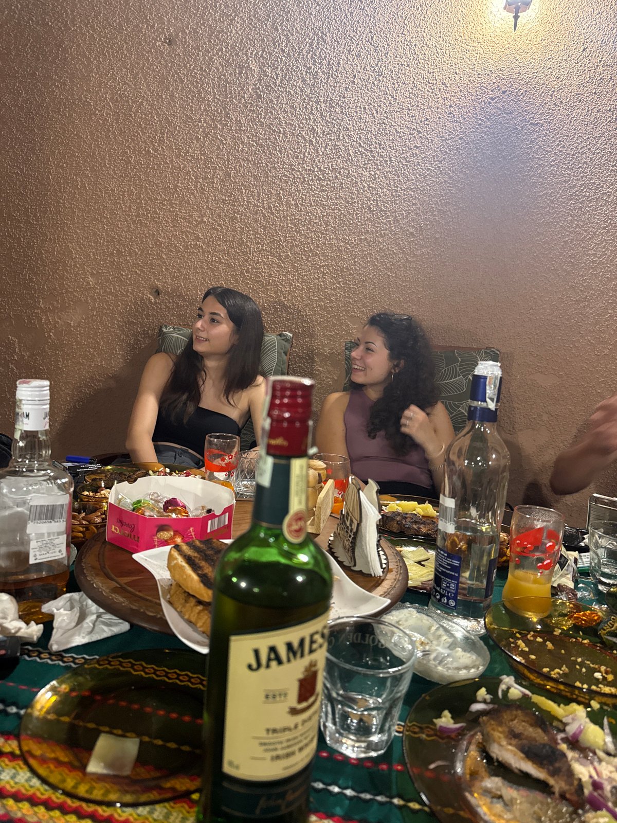 Casual evening gathering around food and drinks in Yambol