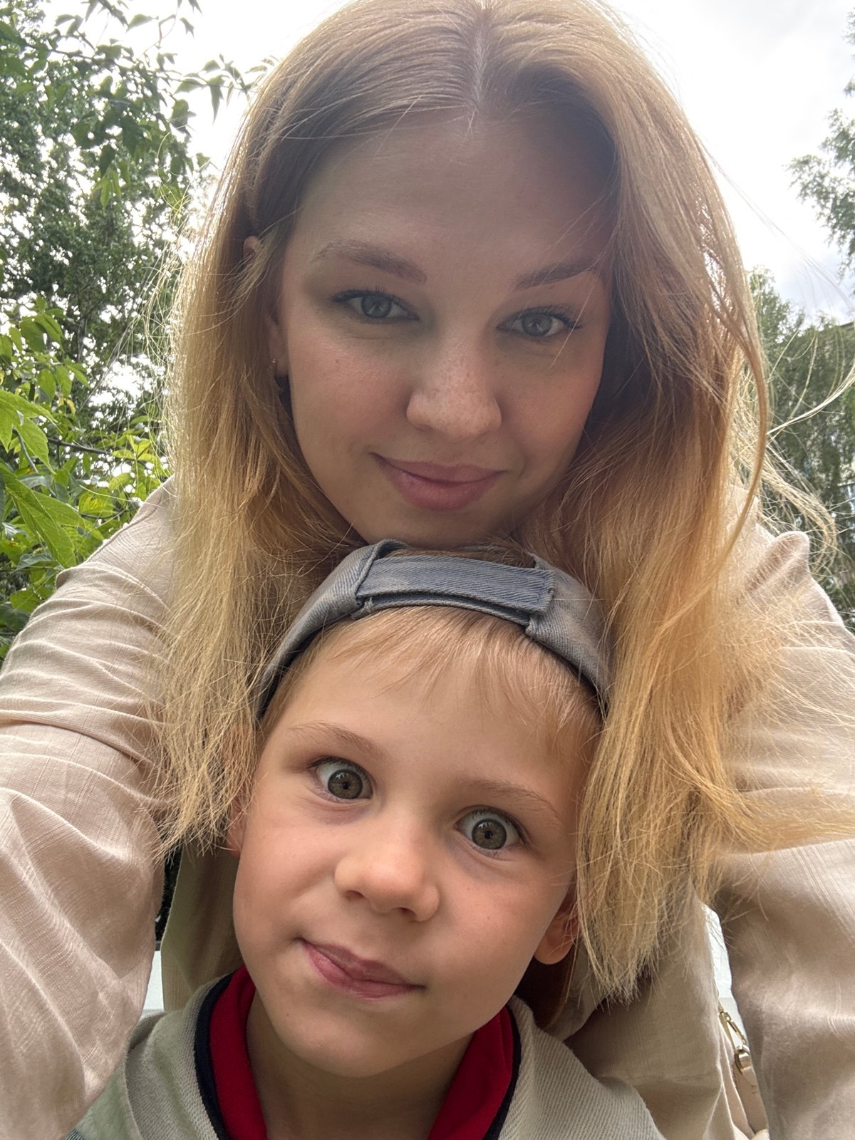 Casual outdoor snapshots near a Rusanovo residential building.