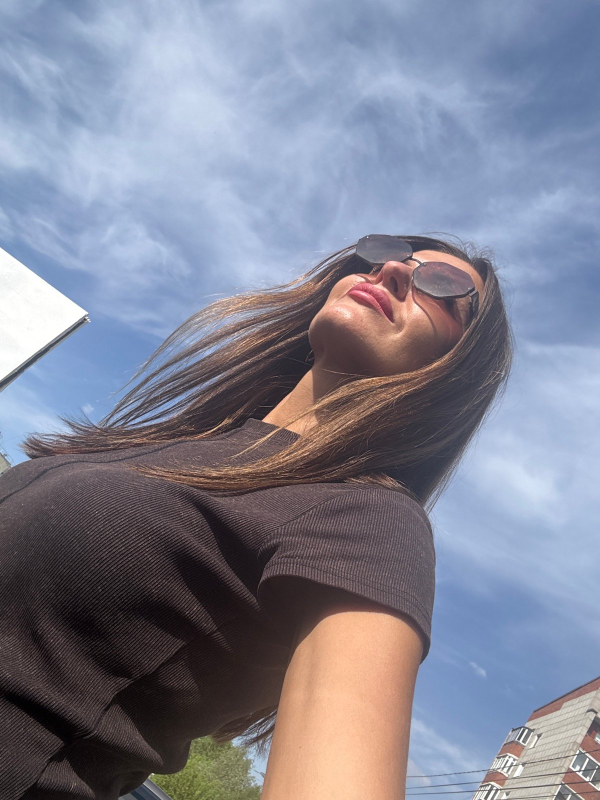 Woman takes selfies outdoors in Chaikovsky, Russia