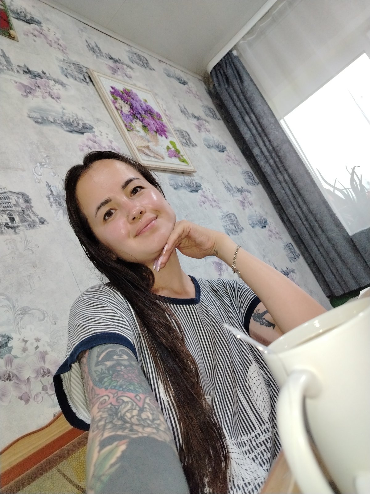 Quick indoor selfie session, striped shirt and mug in hand