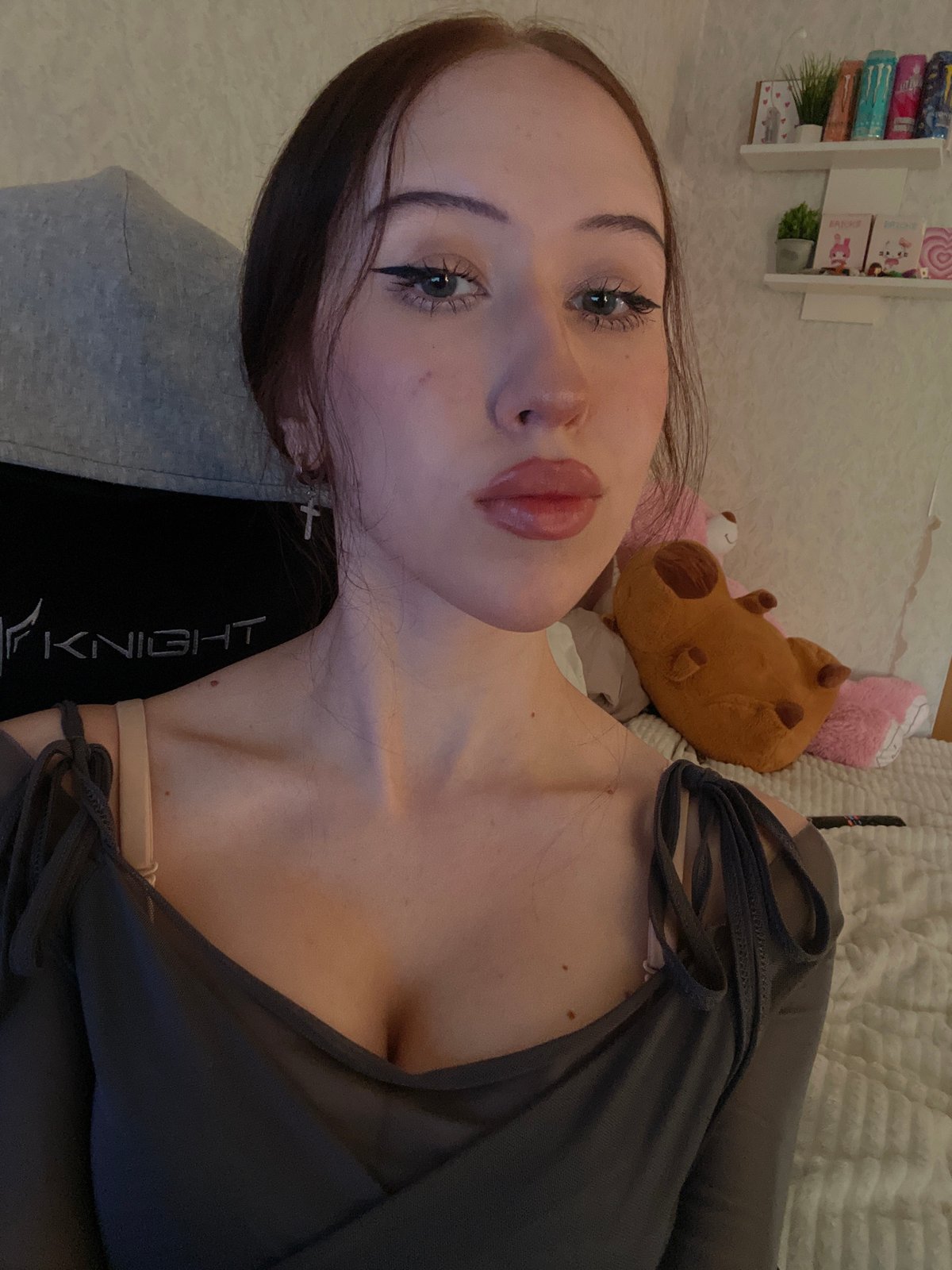 Young woman photographs herself indoors in Votkinsk, Russia