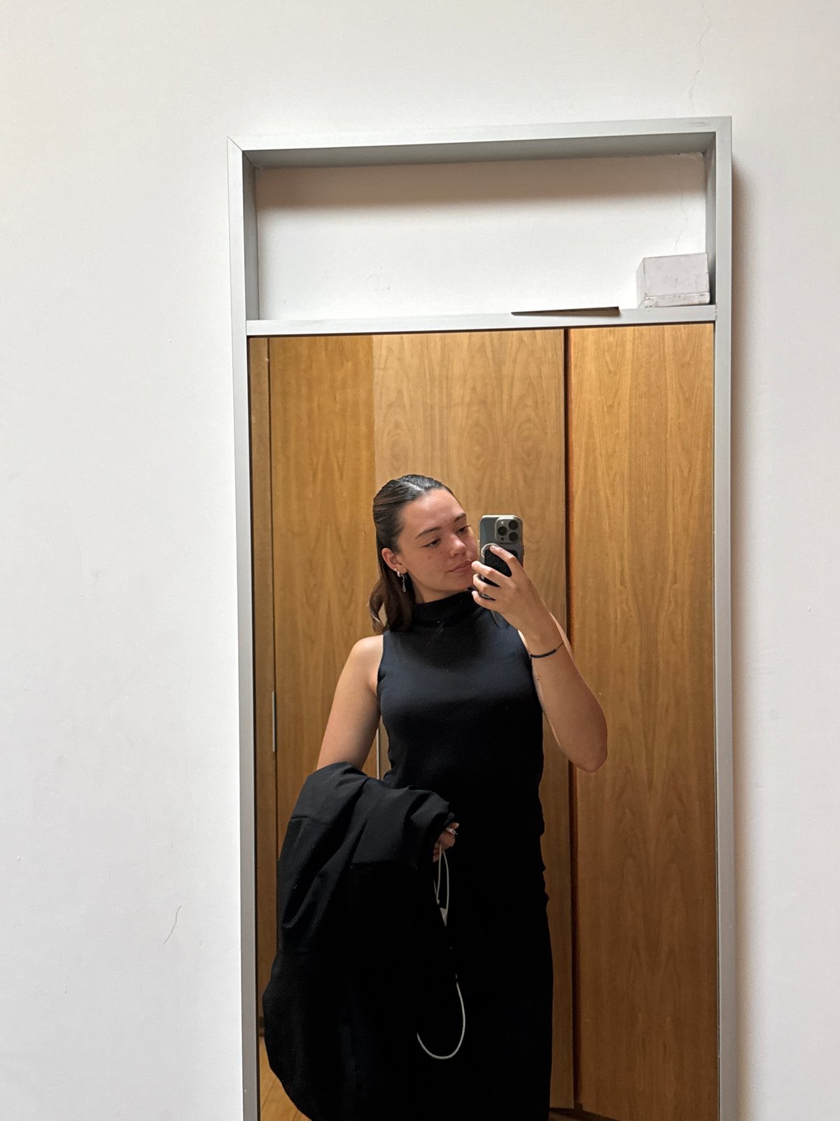 Woman takes mirror selfie in San Bernardino Tlaxcalancingo, Mexico