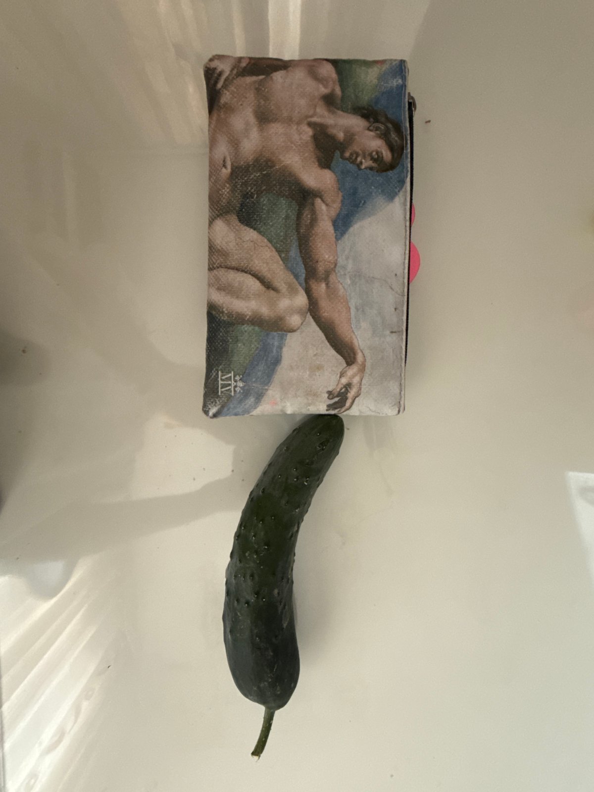 Kragujevac resident documents cluttered desk featuring cucumber and art supplies