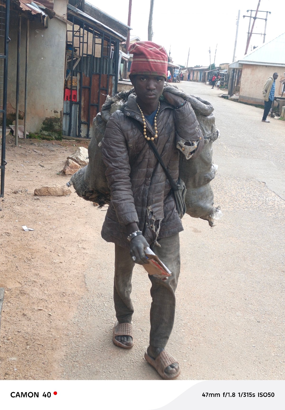 Street-level activity on a Jos road, July 2026