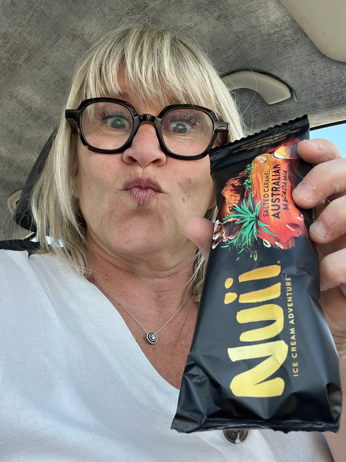 Woman enjoys premium ice cream bar in Saint-Galmier
