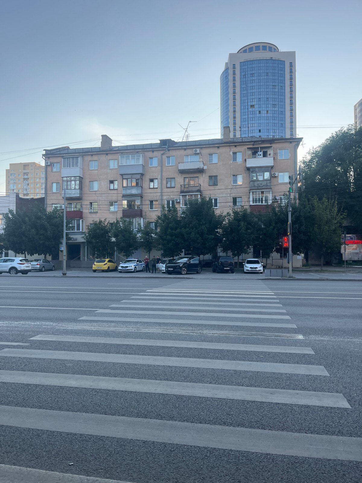 Street-level views of a busy Voronezh road and crosswalk