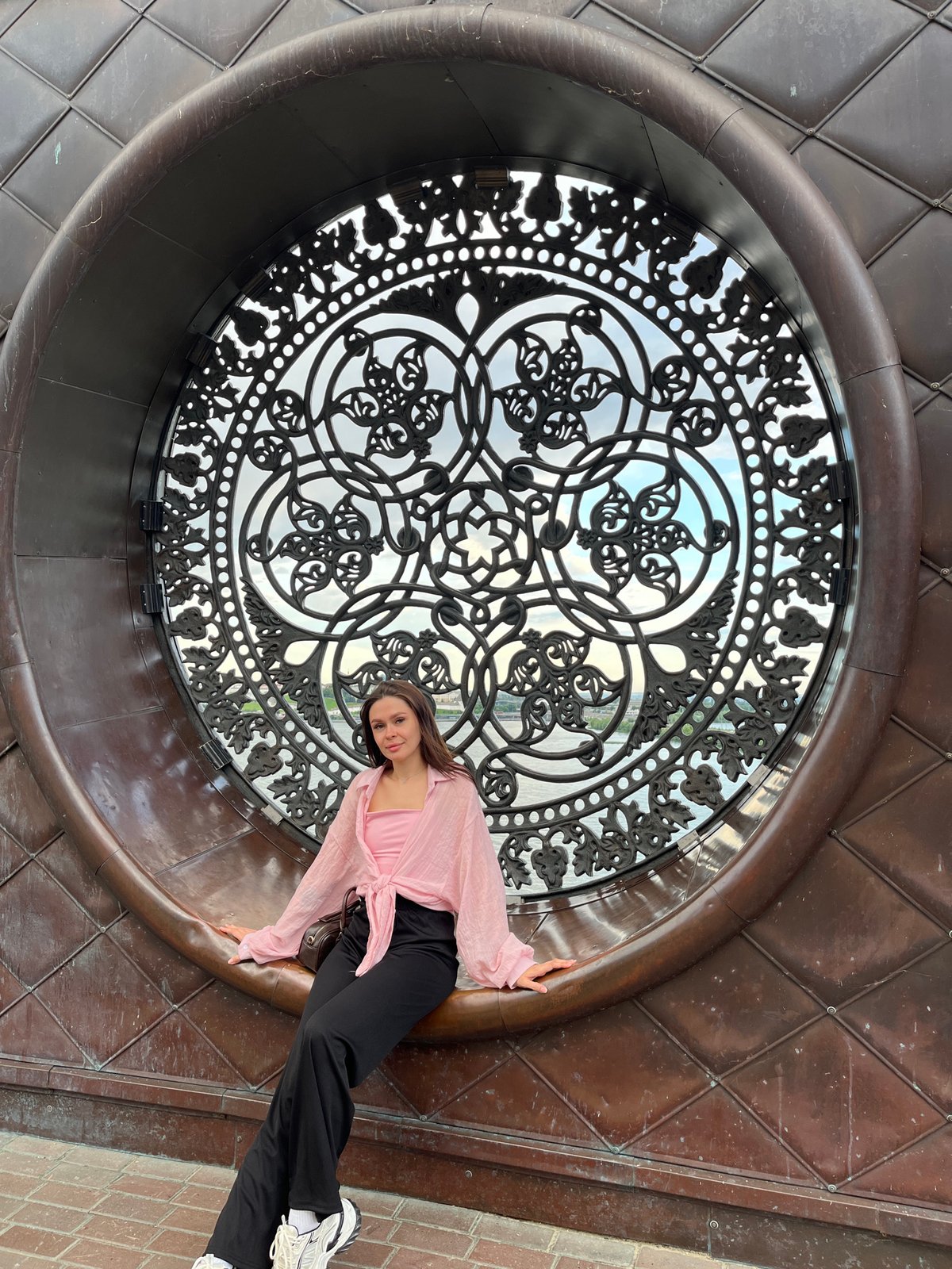 Posing at an ornate metalwork installation in Kazan