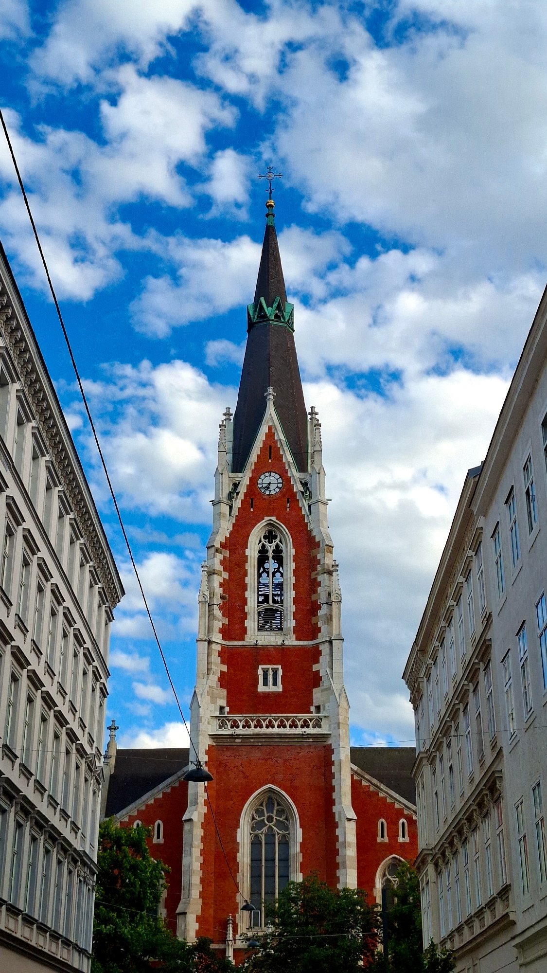Street musician performs at historic Vienna church steps