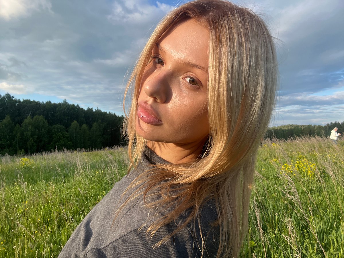Woman takes selfies in natural landscape near Bol'shoi Bukor