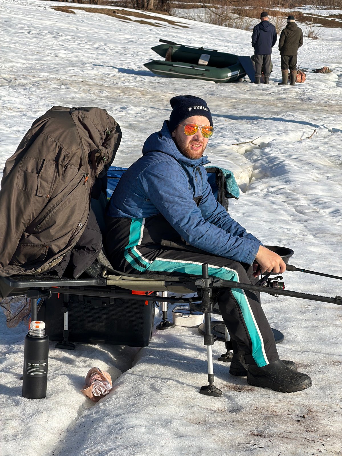 Ice fisherman captured on snowy surface in Chaikovsky