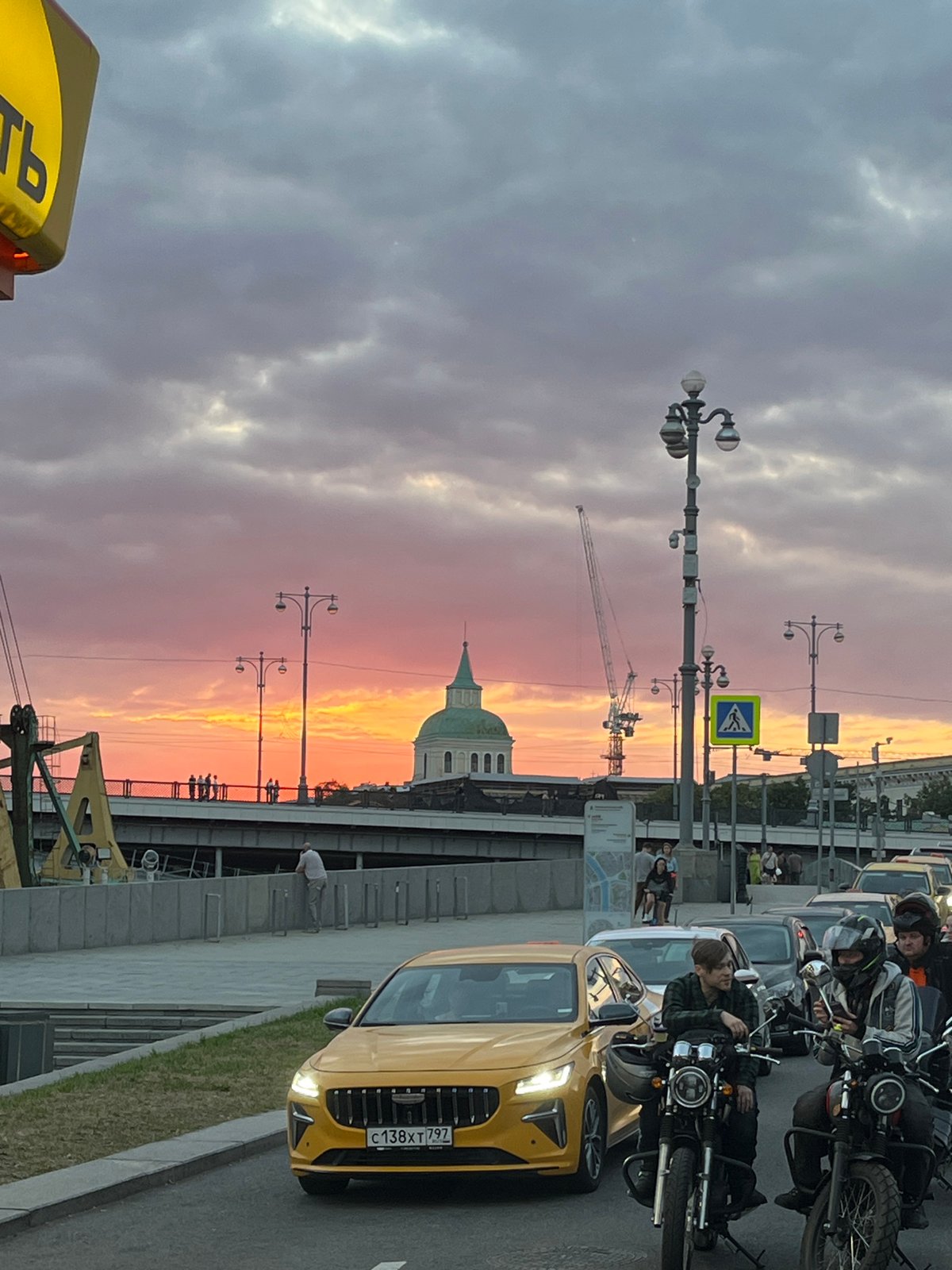 Moscow River at golden hour, streets and skyline at dusk