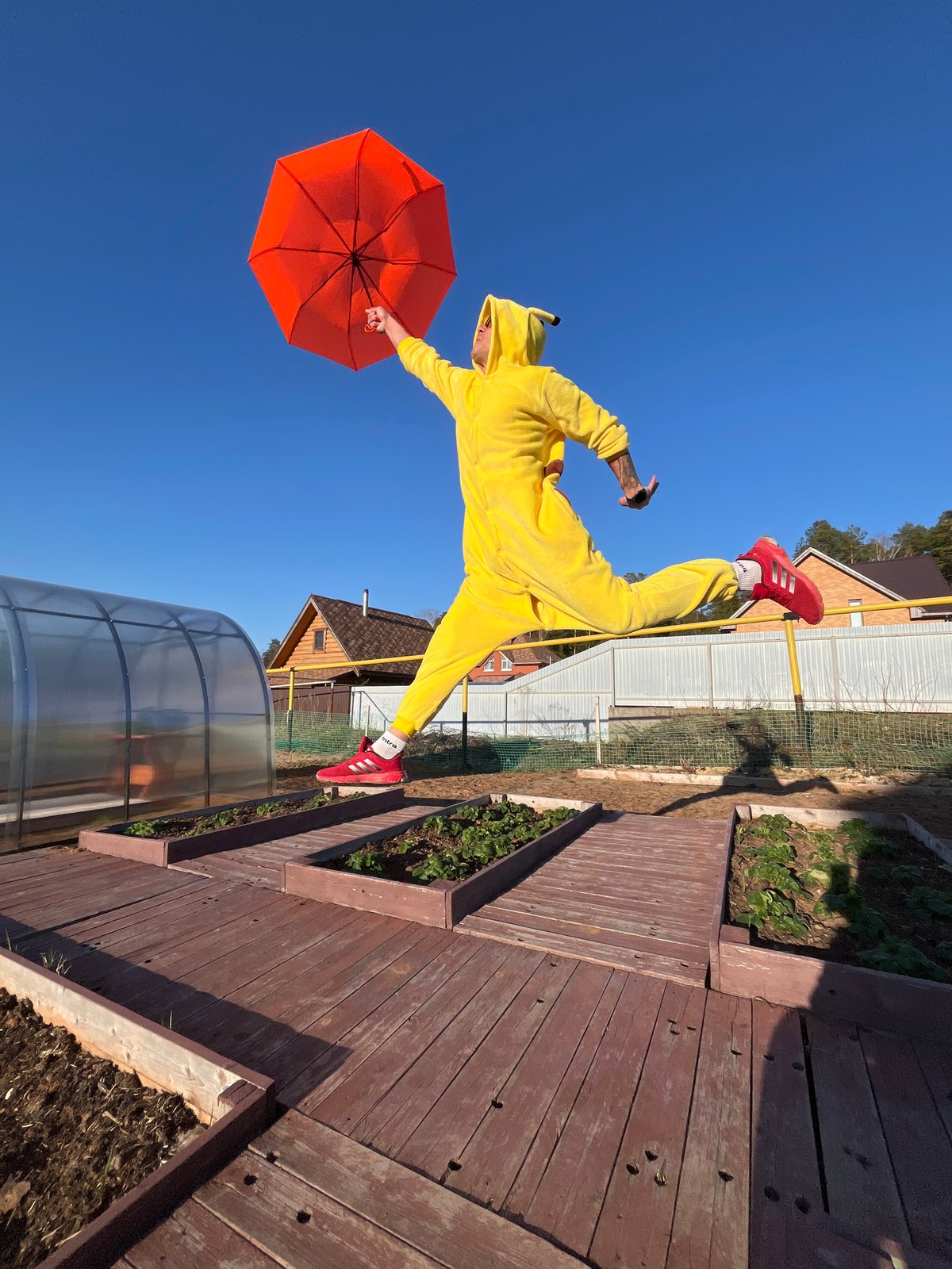 Pikachu-clad person photographed floating with umbrella in Russia