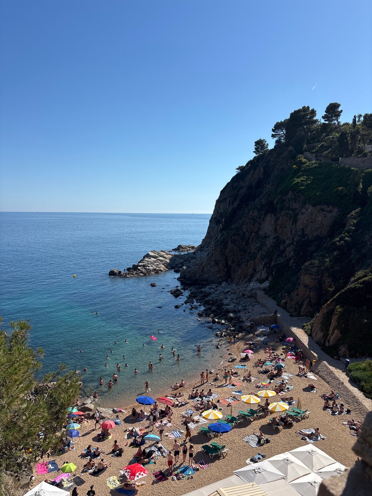 Busy afternoon scenes captured across Tossa de Mar beaches and streets