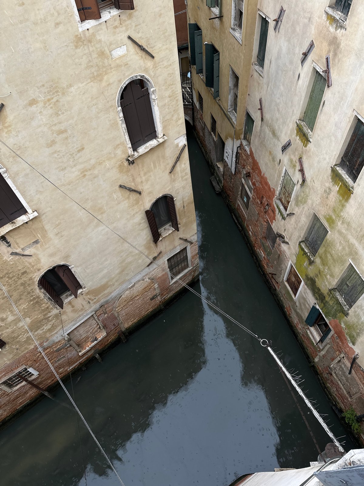 Venice canal scene documented amid weathered historic buildings
