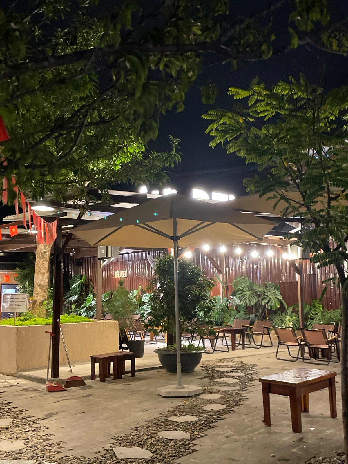 Evening at illuminated outdoor cafe in Đà Lạt