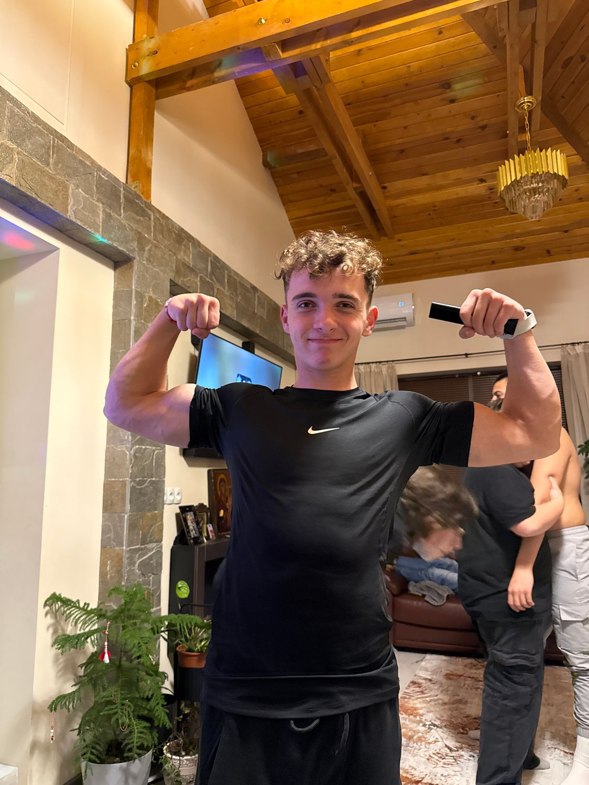 Young men pose and hang out indoors in Berkovitsa