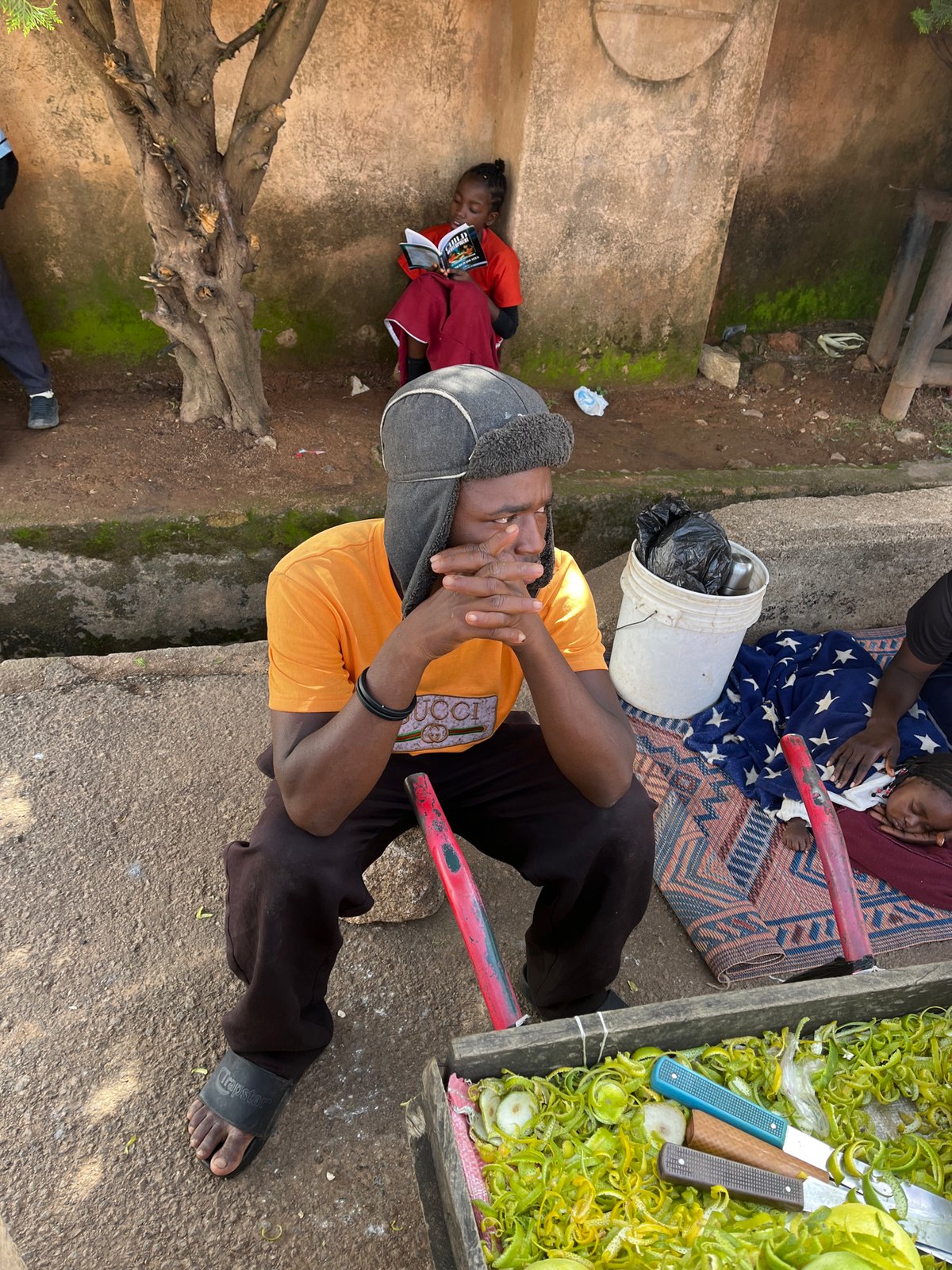 Everyday street life across two Nigerian communities, midday