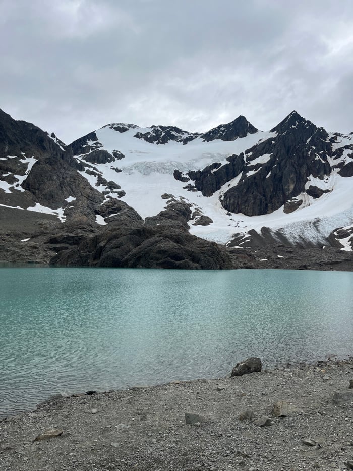 Snow-capped mountains and still waters photographed in Ushuaia