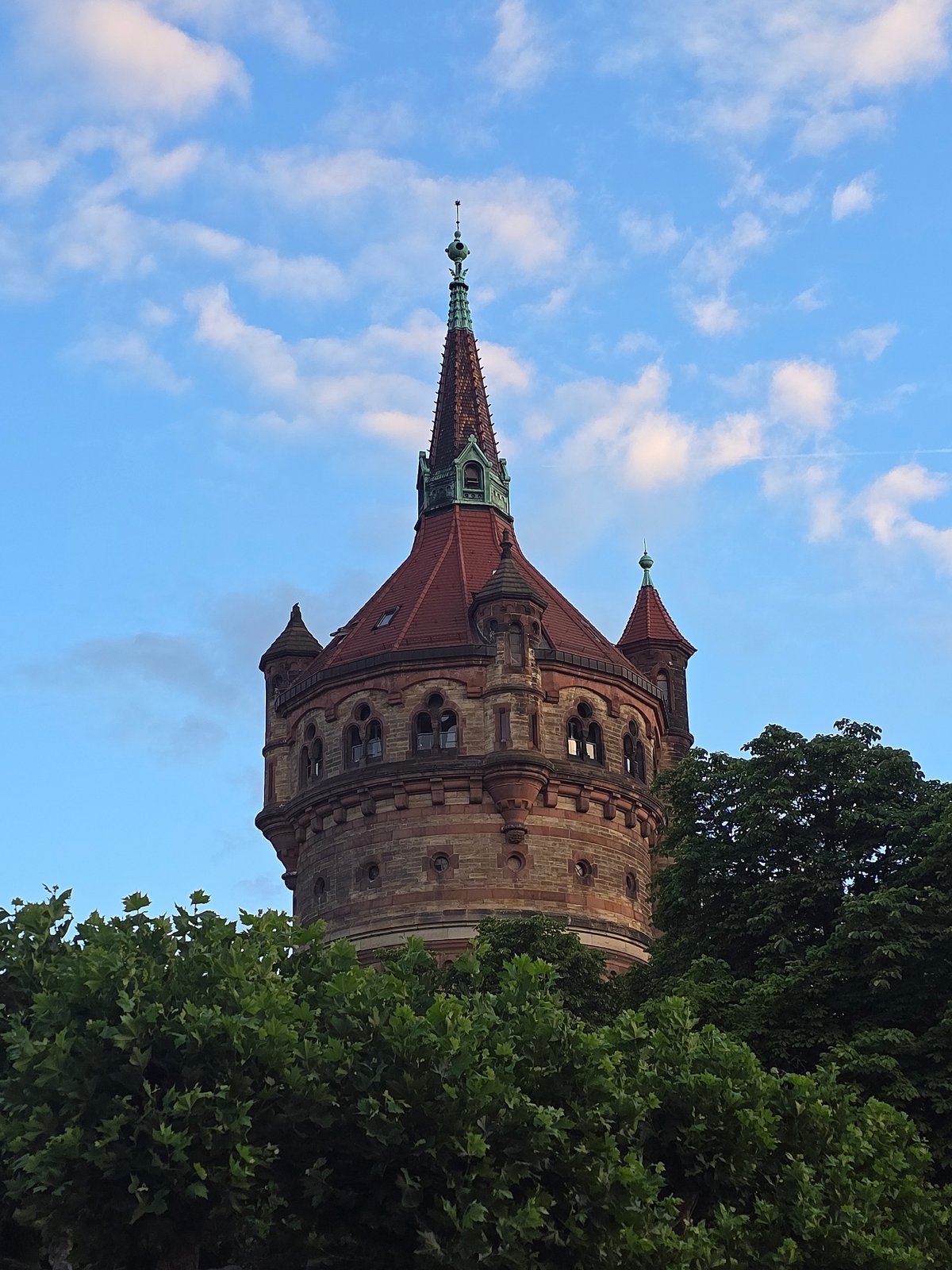 Worms Water Tower photographed from multiple angles on a summer evening