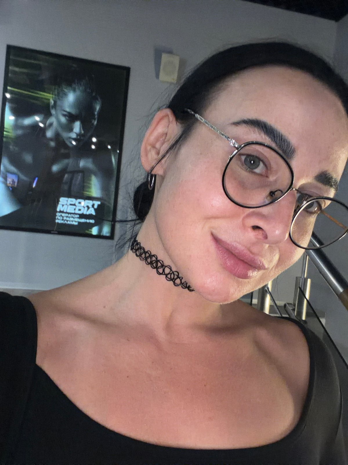 Woman takes selfies indoors in Saint Petersburg apartment